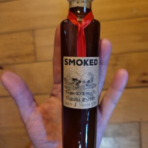 Image of 4 ounce bottle of goourmet vanilla extract, made with smoked vanilla beans and extracted at triple the fda strength of standard vanilla extract.